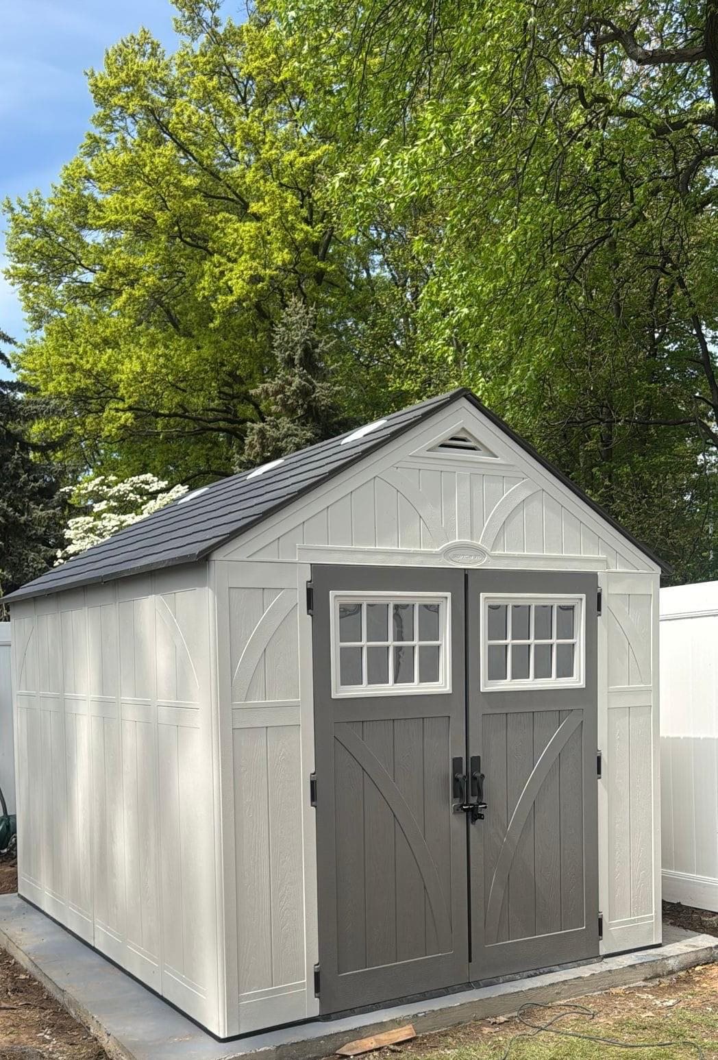 Backyard storage shed assembled and installed